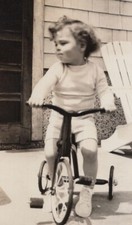 Child Riding Tricycle on Porch Childhood Playfulness 1940s