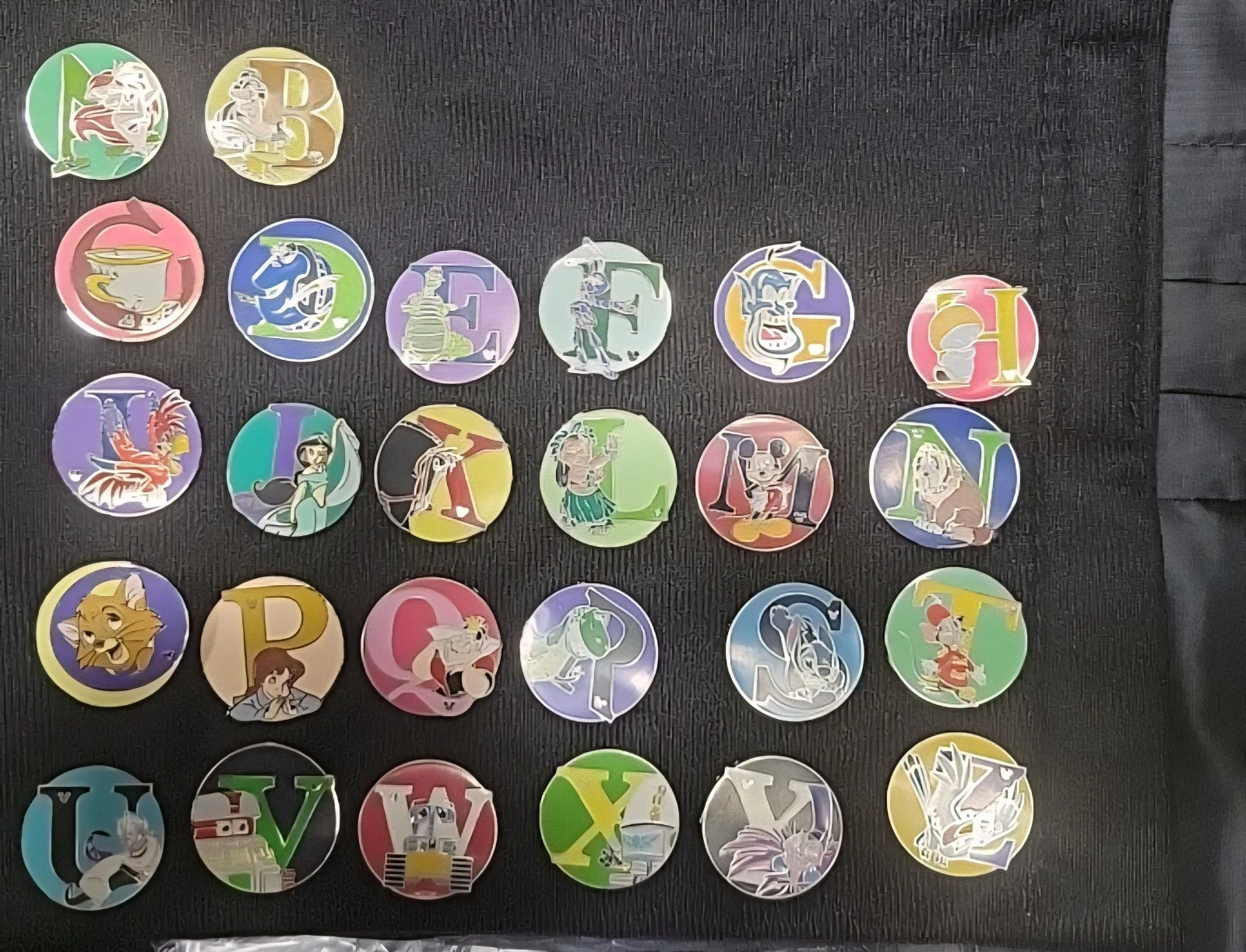 Disney alphabet trading pins, 2008 Hidden Mickey series from Disneyland Resort.