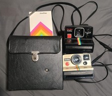 Lot 2 POLAROID ONE STEP CAMERAS SPECIAL RAINBOW STRIPE BAG MANUAL UNTESTED A20
