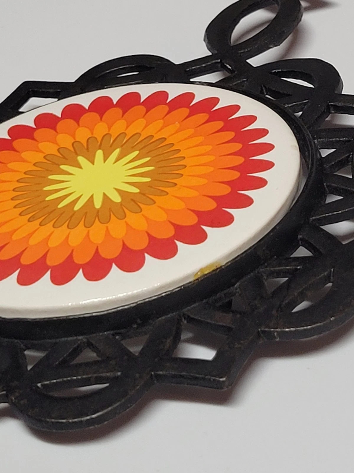 vintage 1970s psychedelic floral cast iron trivet and hot pad - product detail image 7