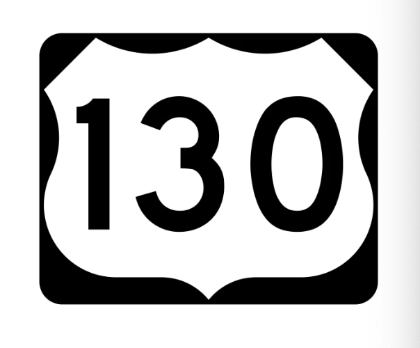 Black and white 7-inch US Route 130 highway sign with rounded corners and bold black “130” text on the side.