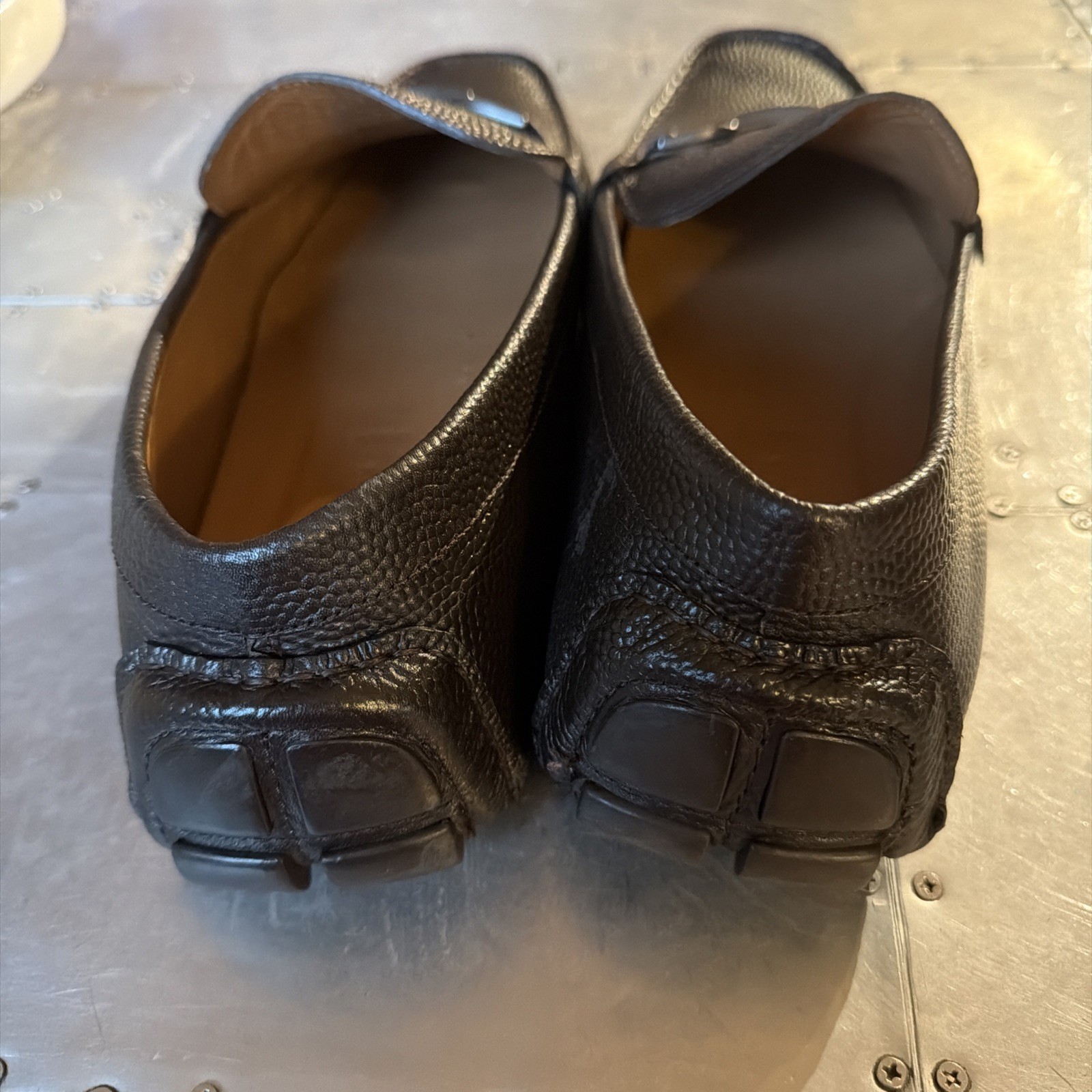 Dark brown leather Allen Edmonds men’s loafers with moccasin stitching and low black rubber soles, size 13D, made in USA.