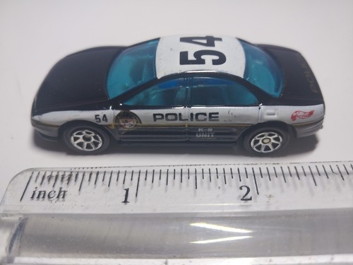 Vintage 1993 Hot Wheels Oldsmobile Aero Police Car No. 54 K9 Unit Warner
