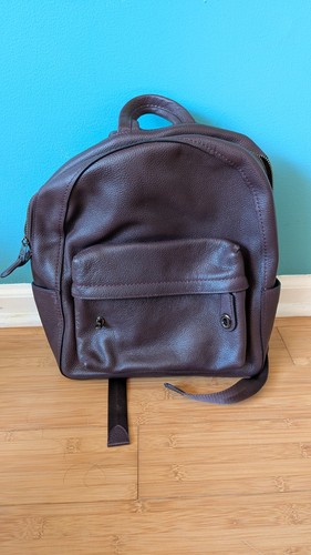brown leather Coach backpack with tags. Zip closures, interior pockets
