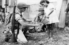 WW2 Picture Photo US soldier getting water from a girl 1942 1366