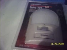 emerson  new in clamshell portable safety light w/motion detector  and alarm