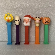 LOT OF 5 VINTAGE PEZ DISPENSERS-Maggie, Skull (B), Santa(C), Tigger, Pumpkin (B)