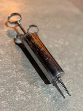 Vintage Becton Dickinson “Empire” reusable metal medical syringe with finger rin