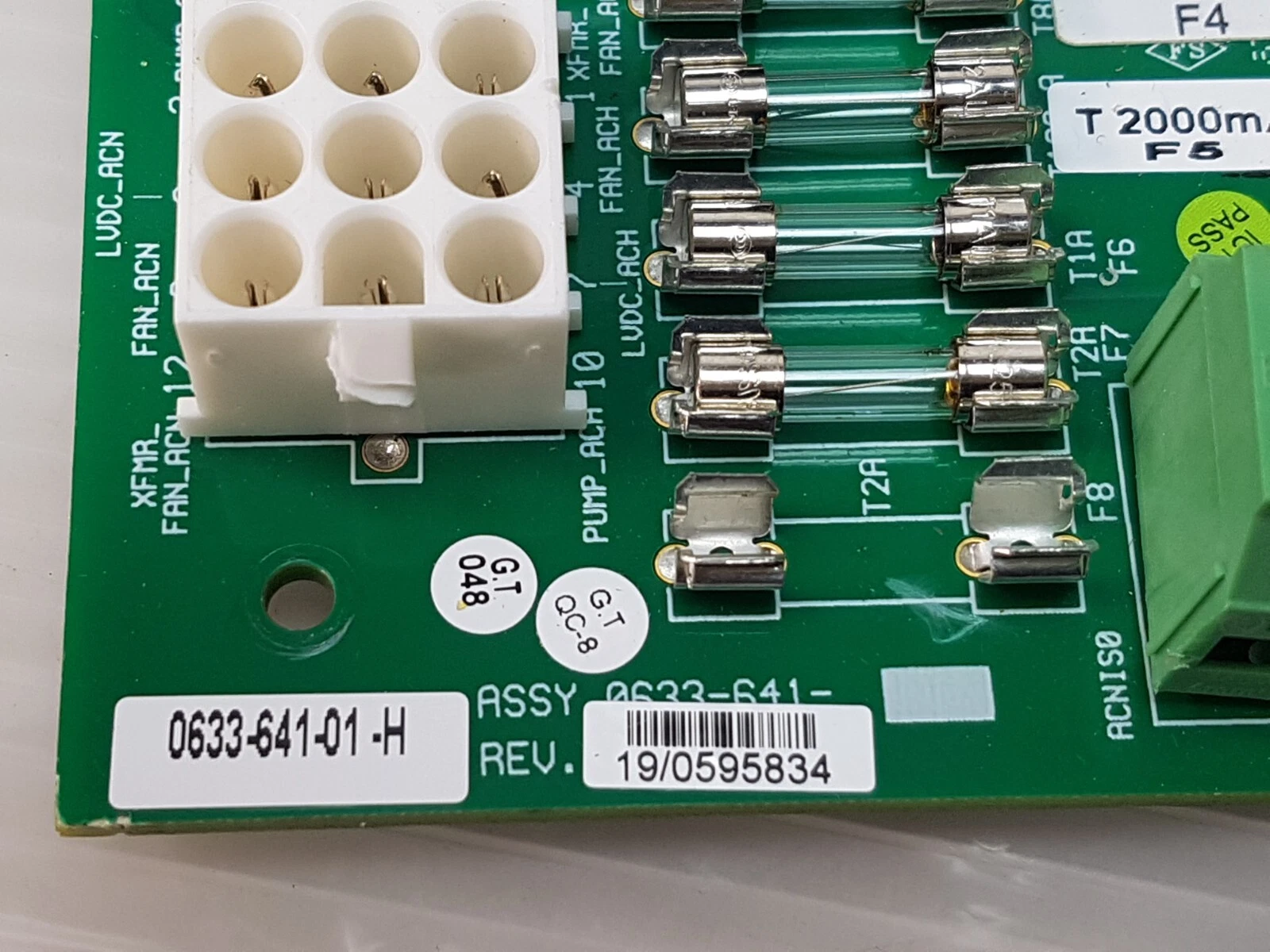 Close-up of the 0633-641-01 -H label, fuse row and 12-pin connector marked PUMP_ACH and LVDC_ACH