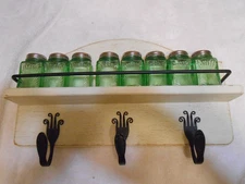 8 green glass spice set with wooden rack