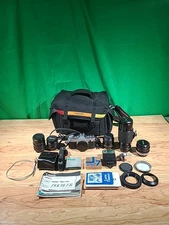 Canon AE-1 Program 35mm SLR w/50mm 1:1.8,FD 70-210mm 1:4, f28mm 1:2.8 Plus More