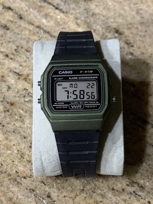 Casio F-91W Mens Watch 33mm Green Case Black Resin Alarm Chronograph Digital