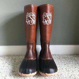 tan and black duck boots