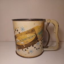 With original label Vintage Androck flour sifter starburst design made USA MCM