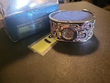 AVON SPARKLING FLOWER CUFF WATCH SILVER TONE W/ LAVENDER RHINESTONES NEW