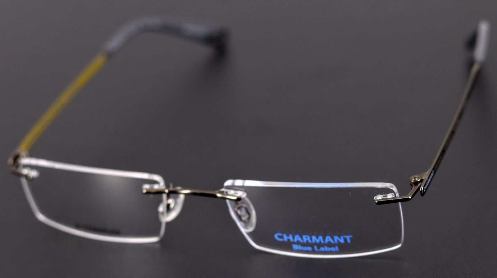 Charmant Blue Label CH10523 BR Brown Rimless Titanium Eyeglasses 51-19-140