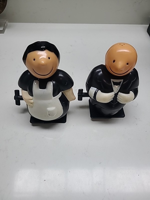 Vintage plastic wind-up   butler and maid salt and pepper shaker set. Hong Kong