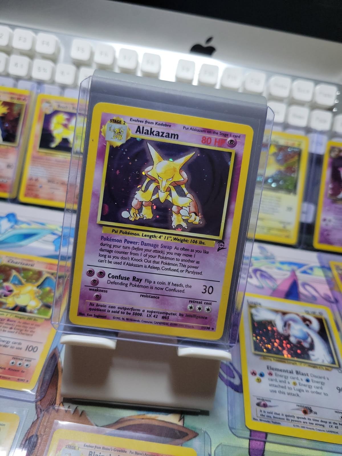 Alakazam 1/130 Base Set 2 Unlimited Holo Pokémon Card SWIRL
