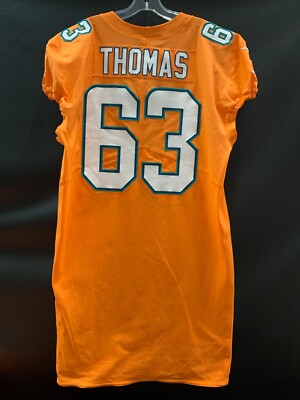 63 DALLAS THOMAS MIAMI DOLPHINS GAME USED TEAM ISSUED ORANGE COLOR