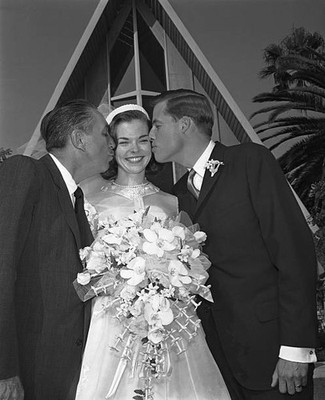 Mrs Robert Brown former Sharon Mae Disney receives two kisses here- Old Photo