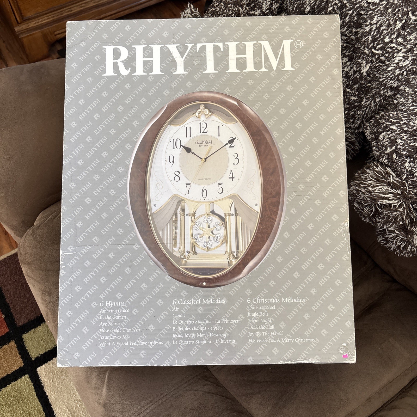 Rhythm Small World 4MJ899WD23 Wood Grain Clock Musical 18 Melodies