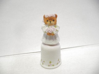 THIMBLE BISQUE ENESCO LUCY RIGG '86 TOPPER OF TEDDY BEAR AS A FLOWER GIRL?