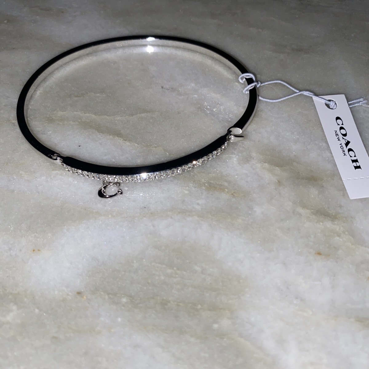 COACH* SIGNATURE “C” PAVE BAR HINGED BANGLE BRACELET COACH* SIGNATURE “C” PAVE BAR HINGED BANGLE BRACELET