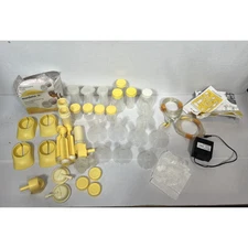 Lot of Medela nursing pads Bottles Caps Manual Pump Nipples Flanges Valves