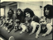 1986 Press Photo Moms exercising their infants at a specialized place in NYC.