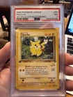 1999 Pokémon TCG Jungle Pikachu Card W-Stamp 1st Edition 60/64 PSA 7