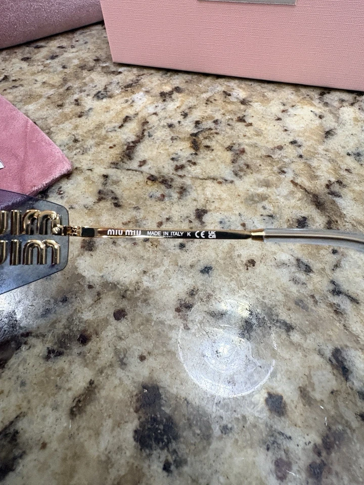 Gafas de sol para mujer Miu Miu A51S ZVN90O azules y doradas Foto 4 de 4