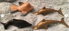 Vintage Brass, Coal & Wood Pod Of Dolphins (4)