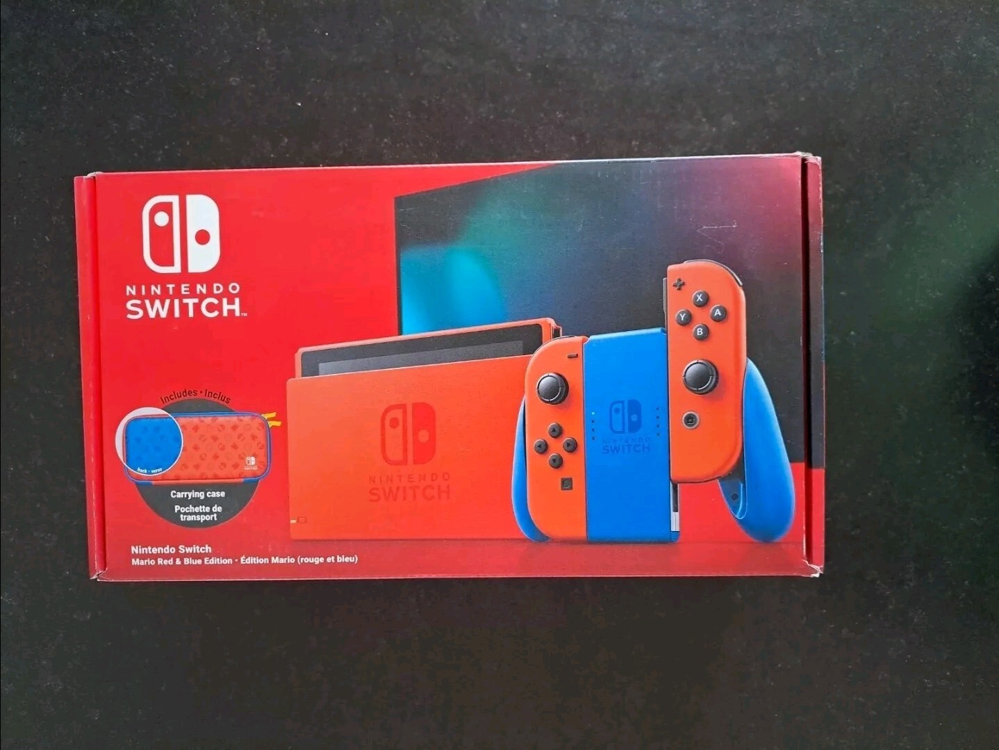 Console Nintendo Switch Mario Red & Blue neuve avec console rouge et pochette anniversaire