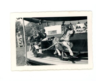 Boy on horse  carousel merry go round  Vintage snapshot photo circus carnival