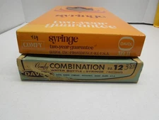 A PAIR of VINTAGE DAVOL COMFY WATER BOTTLE/SYRINGE COMBINATION #12