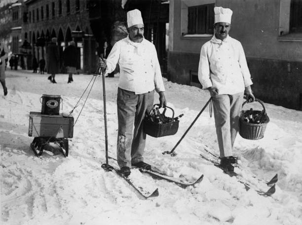 Two cooks form a hotel in St Moritz at their daily shopping tour o- Old Photo