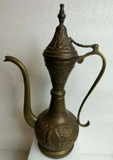 Vintage Indian style brass teapot with pressed decorations.