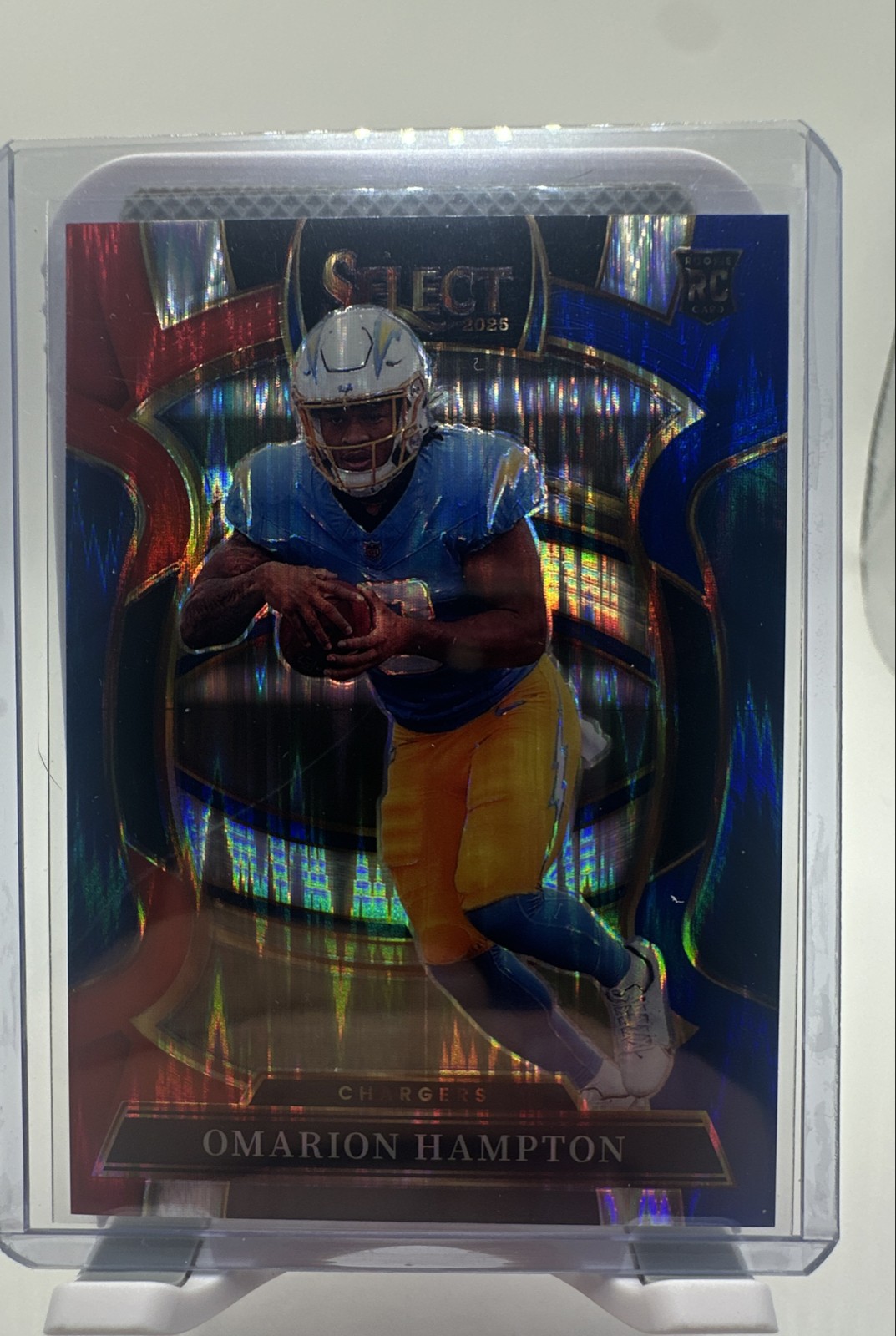 2025 Panini Select - Concourse Omarion Hampton #2 Red & Blue Shock Prizm (RC)