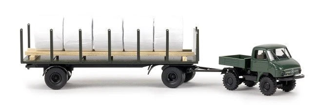Brekina 39114 - 1/87 Unimog 411 Mit Rungenanhänger & Ladegut Heuballen - Neu - Bild 1 von 1