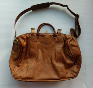 tumi leather handbag
