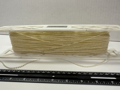 trim beaded hand sewn seed pearls in ivory.  
