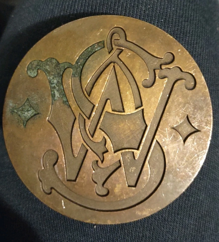 Vintage 1979 Smith & Wesson S&W Logo Belt Buckle – Brass & Bronze Variants - Image 4 of 4