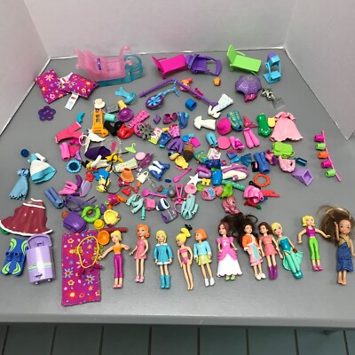 10 Polly Pocket Dolls w/ a ton of cloths, accessories and furniture