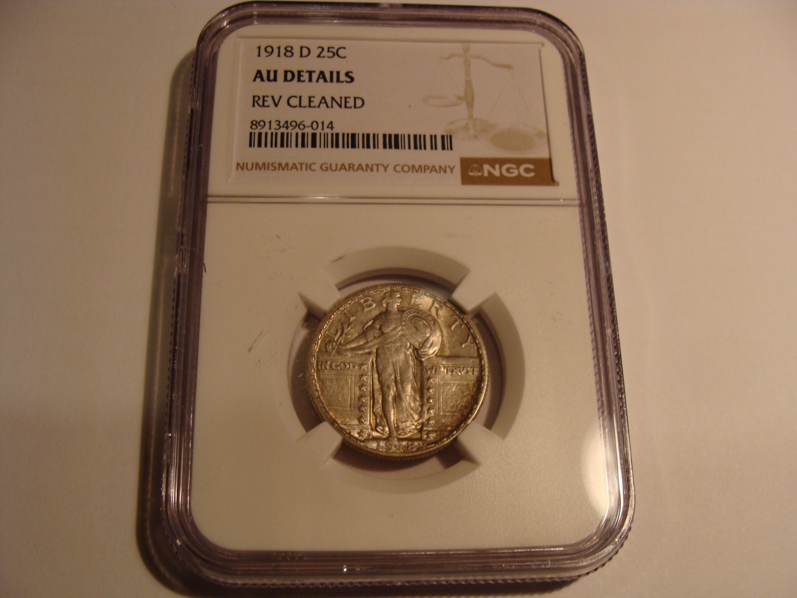 1918-D Standing Liberty quarter, AU details, NGC, showing Lady Liberty profile with “In God We Trust” and date at bottom.