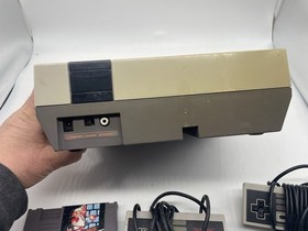 Nintendo NES console 2 Controllers And 1 Game - No Cables. UNTESTED