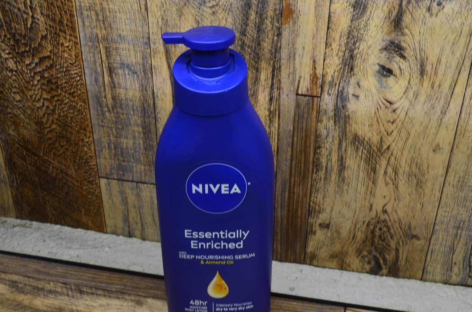 NIVEA Essentially Enriched Nourishing Serum Body Lotion with 20 oz Pump Bottle