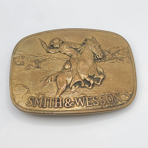 Vintage Smith & Wesson Brass Belt Buckle 1975 The Hostiles Cowboy Riding Horse