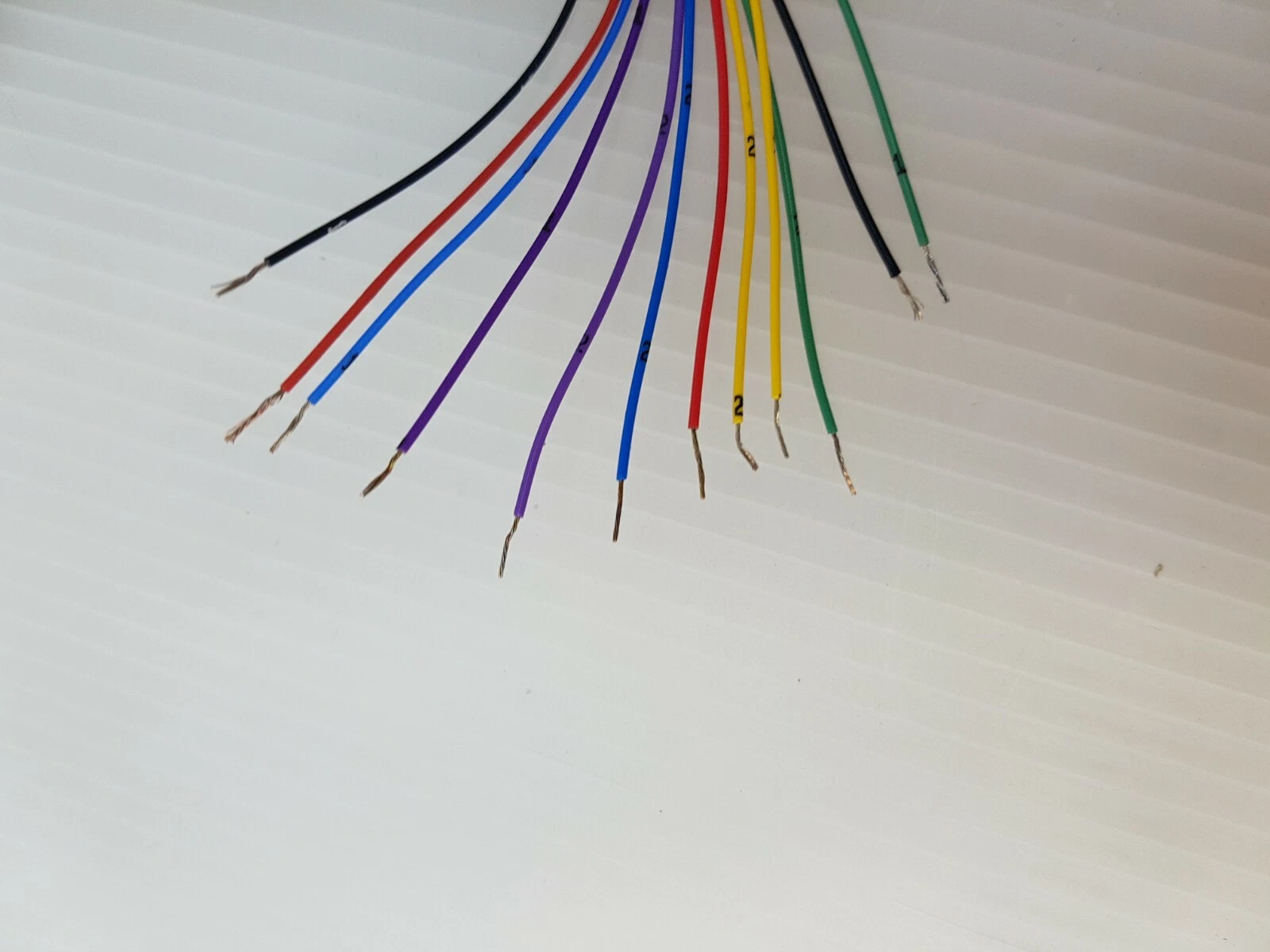Stripped ends of the twelve color-coded leads of the OTTO joystick