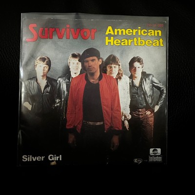Survivor     American Heartbeat   100·14·003 Scotti Bros.  Vinyl 7 45 Single VG+