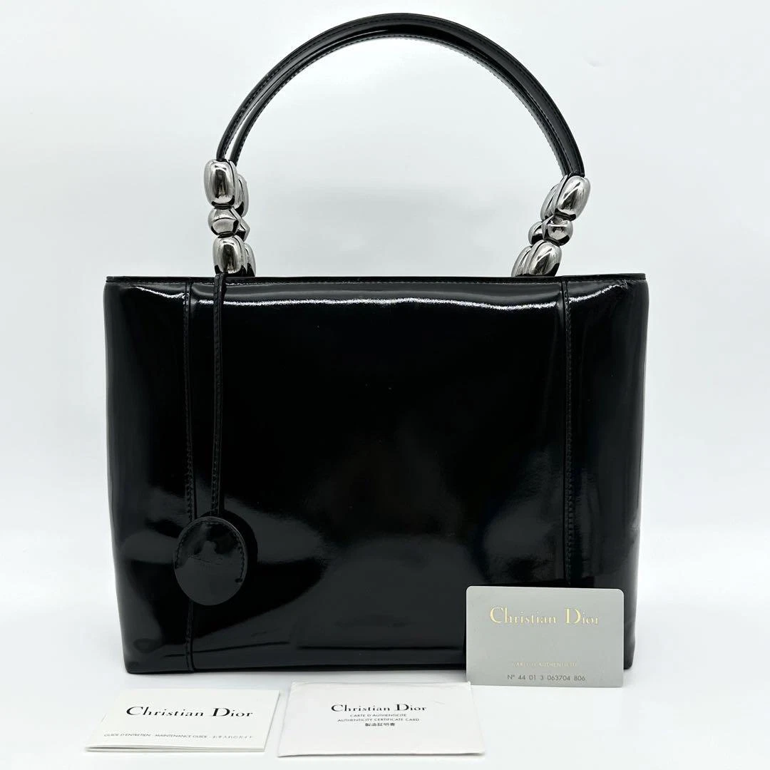 Sac à main fourre tout CHRISTIAN DIOR Malice Pearl cuir verni noir avec clé, carte